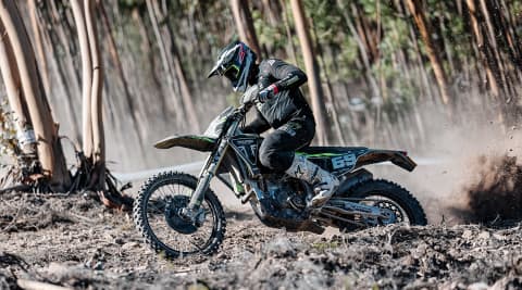 Man riding Triumph Racing Motorcyle at Enduro GP