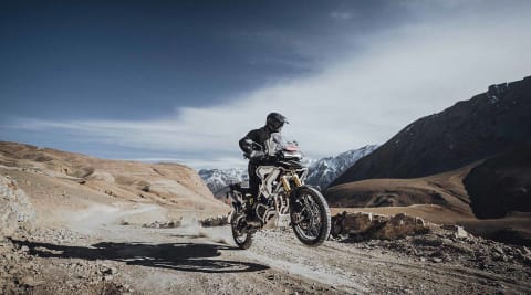 Triumph Tiger 1200 Rally Pro being ridden through the Himalayan Mountain range