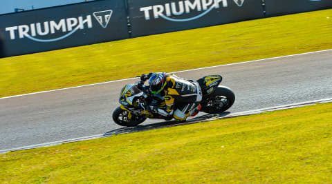 Rider on a racing track on Triumph Daytona 660