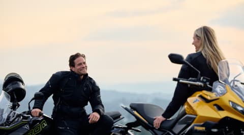 Man and woman sat on Triumph Tiger sport 800