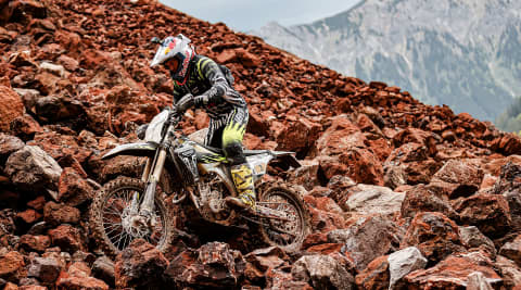 Jonny Walker at Erzbergrodeo on Triumph 250-E on rocky track