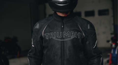 Triumph Motorcycles Black Triple Sports Mesh Riding Jacket with large Triumph logo on chest. D3O Armour.