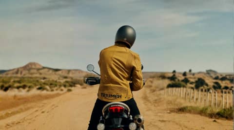 Braddan Air Race Gold on Triumph Bike in Desert