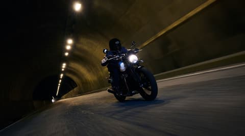 Triumph Speed Twin 900 riding shot through a tunnel