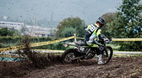 Man riding Tirumph Enduro bike on dirt at EnduroGP