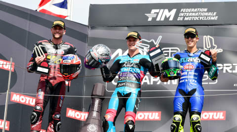 Dani Holgado, Jake Dixon and Manuel Gonzalez holding trophies at Moto2