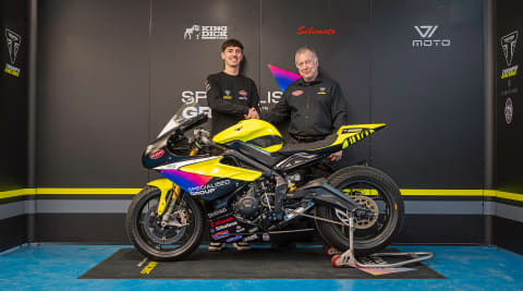 Two men stood behind Triumph Street Triple 765 RS