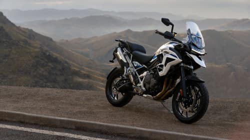 Stationary Triumph Tiger 1200 Alpine Edition on the side of the road