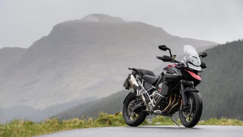 Triumph Tiger 1200 GT Explorer stationary overlooking hills