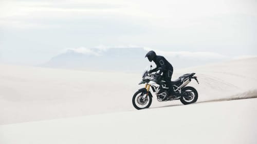 Action shot of Triumph Tiger Rally Pro in Matt Khaki Green
