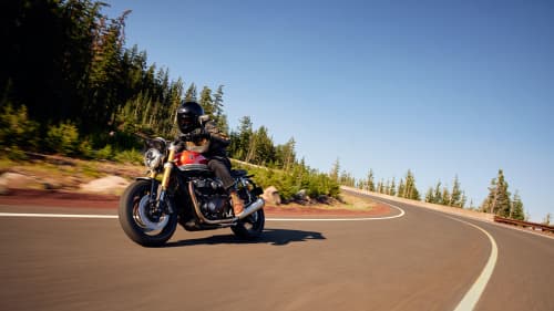 Triumph Speed Twin 1200 RS riding shot clear sky