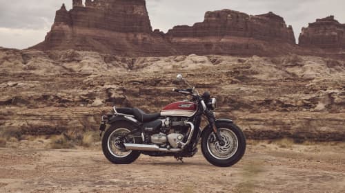 Triumph Bonneville Speedmaster parked in front of rocky mountains