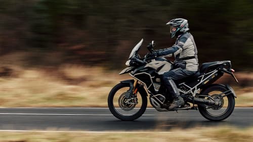 Tiger 1200 riding on mountain road in Scotland