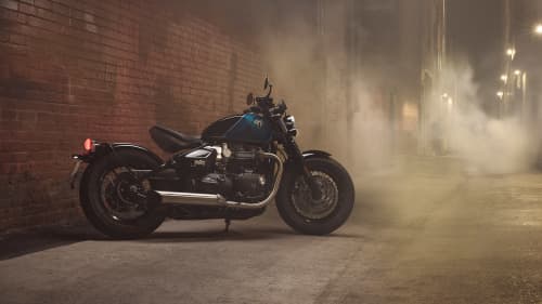 Triumph Bonneville Bobber in Intersteller Blue with a smokey background
