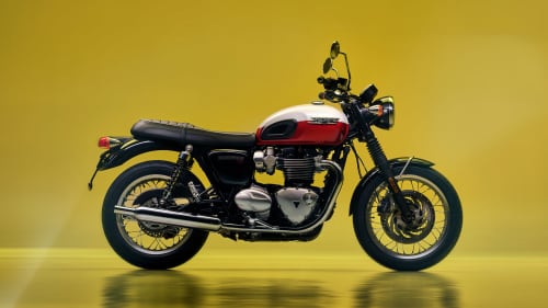 Stationary Triumph Bonneville T129 2025 with a yellow background