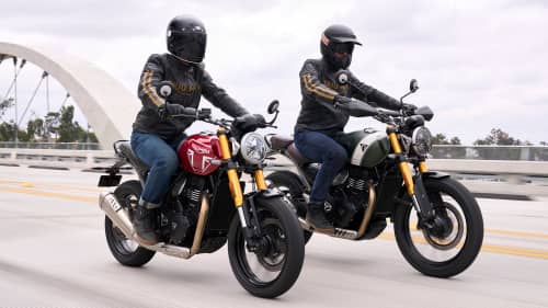 Riders on Triumph Speed 400 and Scrambler 400 X crossing a bridge
