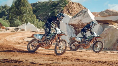 Two riders on the Triumph 250 and 450 enduro bikes