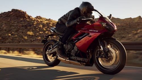 Side view riding shot of Triumph Daytona 660