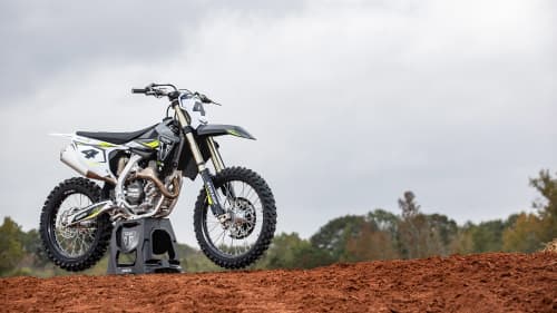 Triumph TF 450-RC Edition stationary on a dirt road