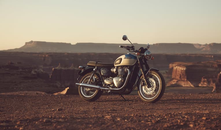 Triumph Bonneville T120 on dusty terrain