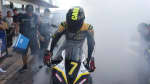 Front view of a racer on Daytona 660 with smoke in the background