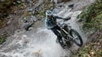 Man riding TF 250-E through water