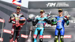 Dani Holgado, Jake Dixon and Manuel Gonzalez holding trophies at Moto2