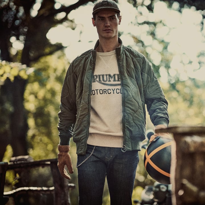 Man in the woods wearing Triumph Lifestyle Aw23 Collection