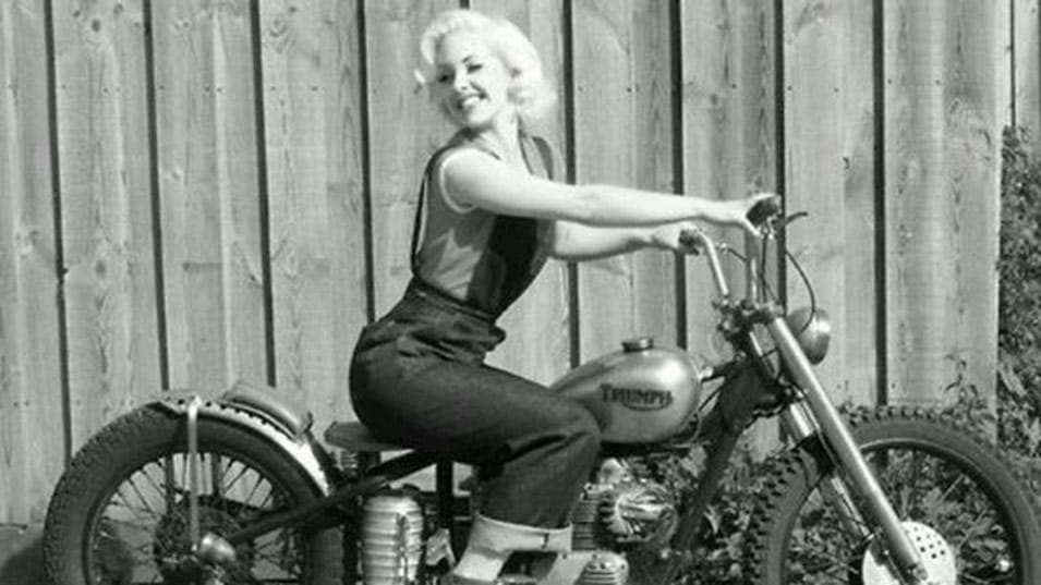 Retro image of lady on a old Triumph Motorcycle