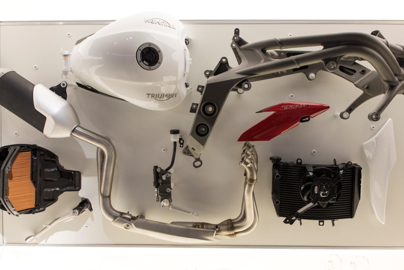 deconstructed bike parts on a white background