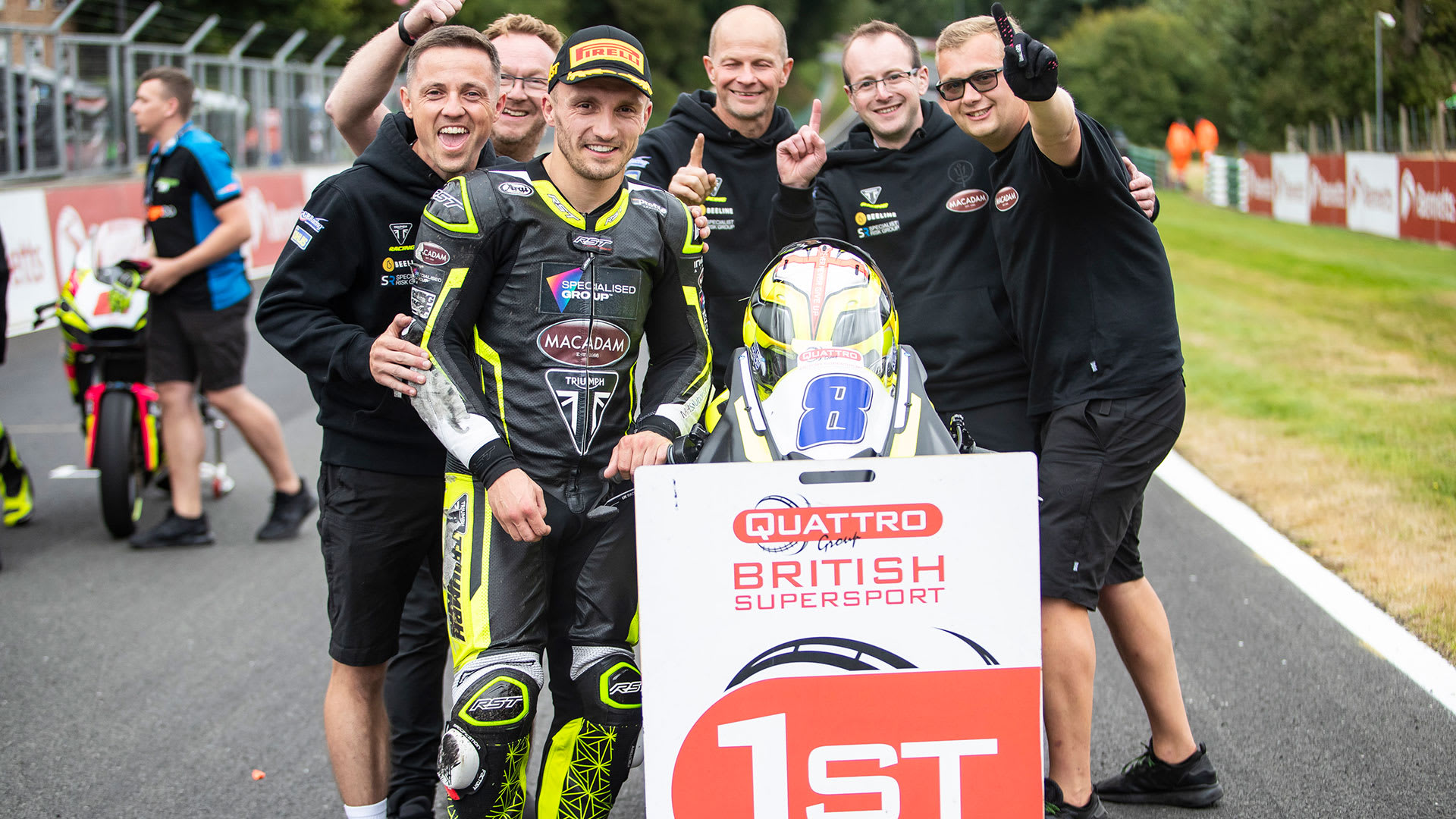 Luke Stapleford and team celebrate race victory in British Supersport at Cadwell Park