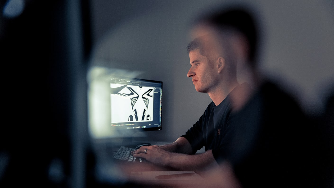 Skda Graphic Founder Sam Morton on a computer