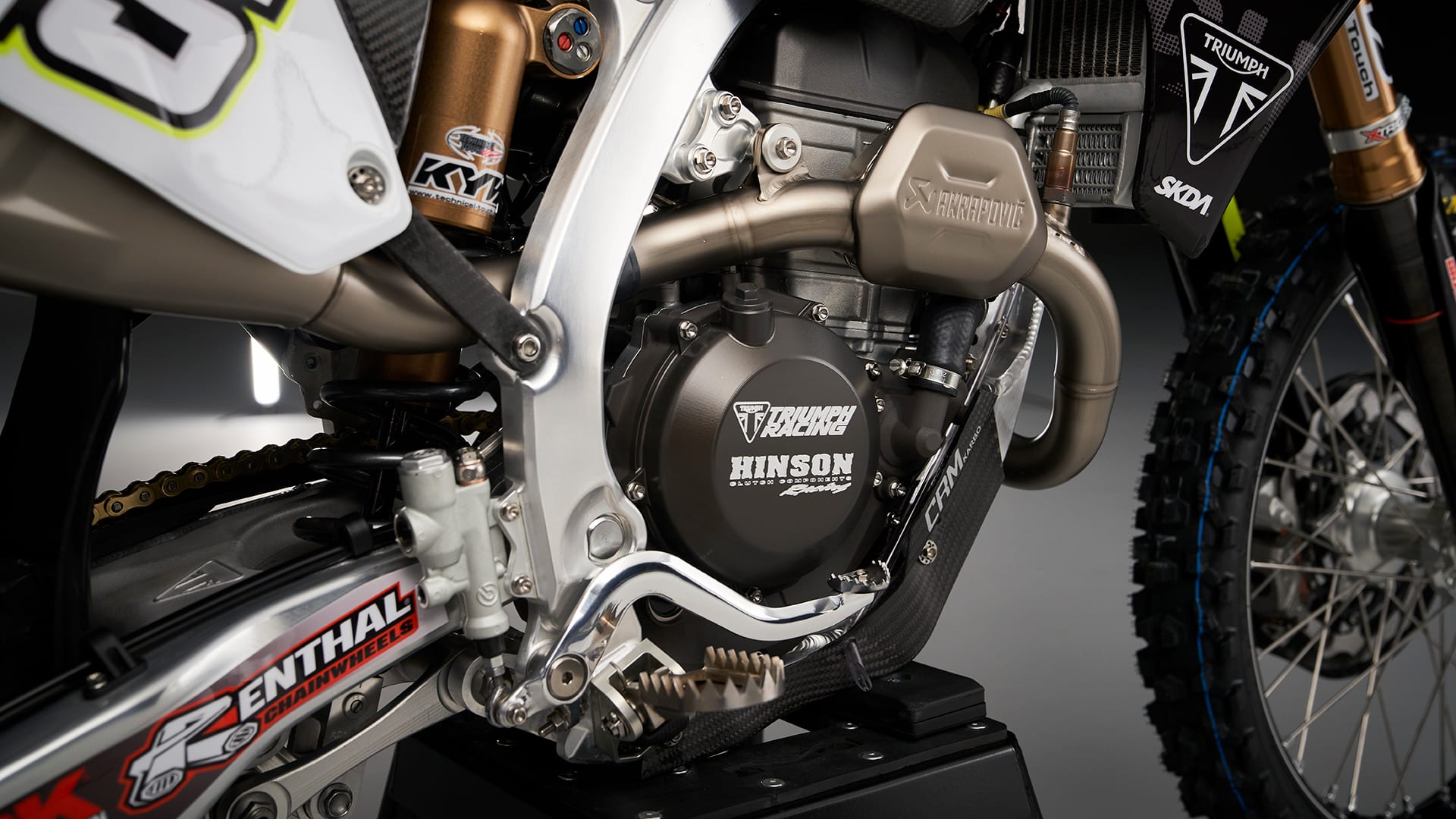 Triumph racing partnership with akrapovič TF 250-X motocross bike part closeup