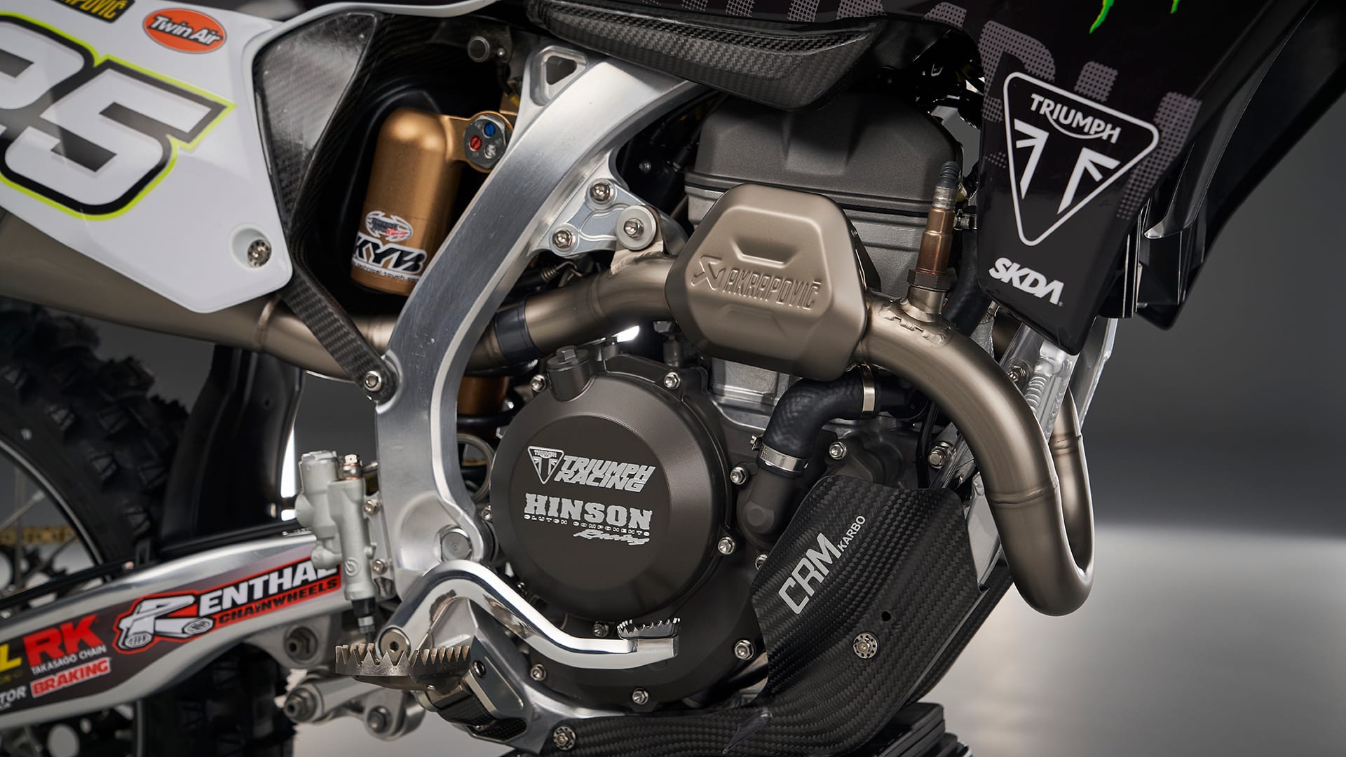 Triumph racing partnership with akrapovič TF 250-X motocross bike part closeup
