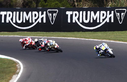 Moto2 Race with Triumph sponsorship in the background