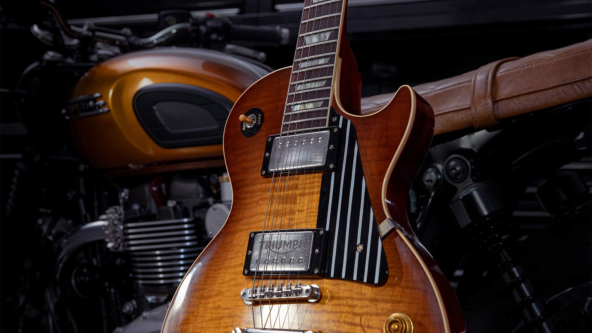 Gibson custom guitar, featuring the “Triumph Gibson 1959 Legends” partnership logo)