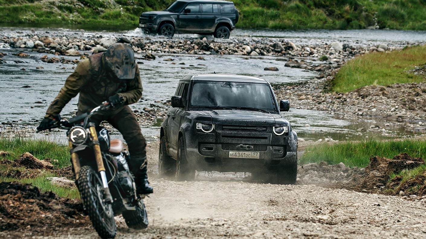 No Time To Die Scrambler 1200 bike chased by the new defender on a tough terrain