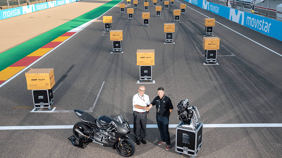 Triumph's Chief Product Officer handing over the Triumph Moto2 engines to Dorna. Moto2 engines layed out on the grid, as they will be when the season begins on the 10th March in Qatar
