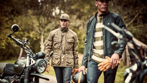 Men near motorcycles wearing Triumph Lifestyle Jackets 