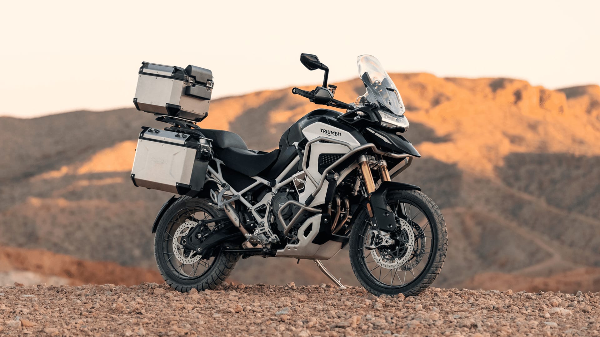 Triumph Tiger 1200 parked in a off-road environment 