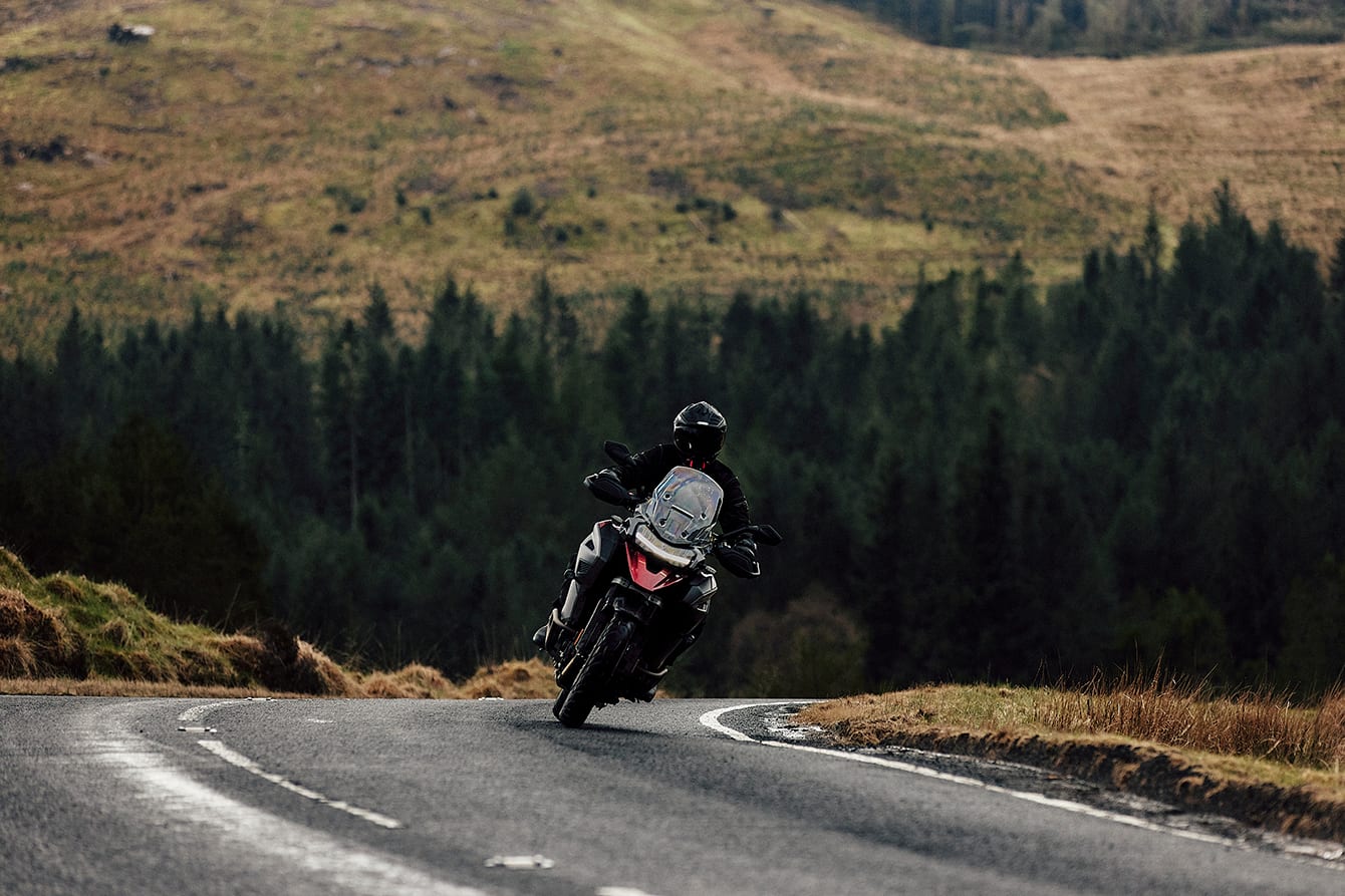 Tiger 1200 riding on mountain road in Scotland