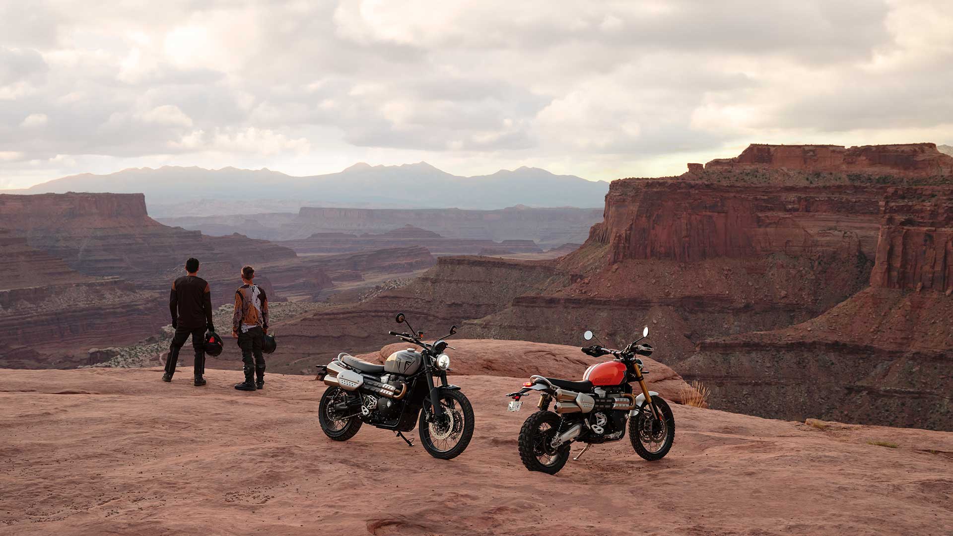 Triumph Scrambler 1200s Parked with Riders In Background