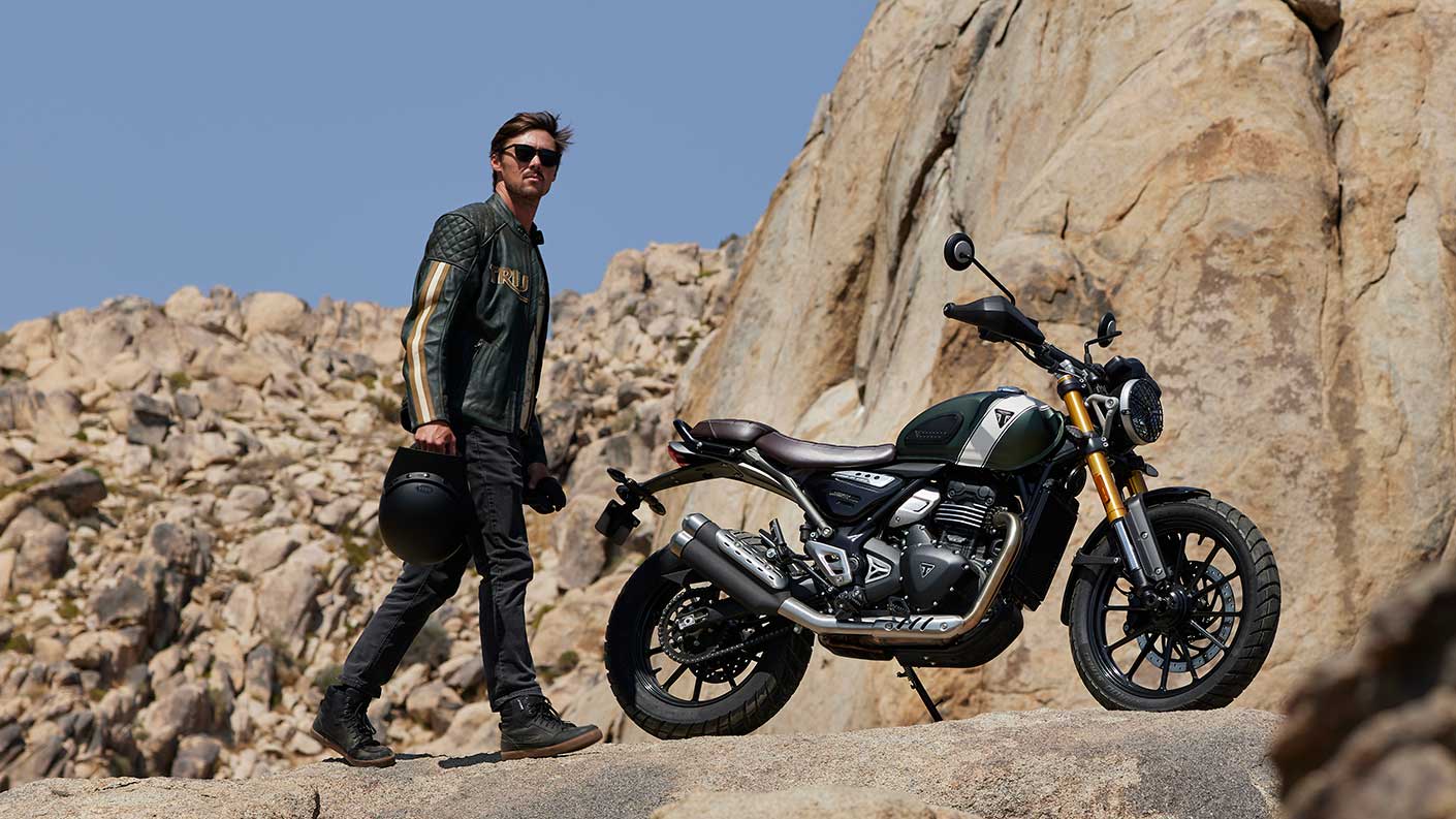 Triumph Scrambler 400 X parked on rock