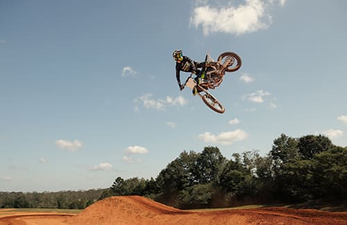Triumph TF 250-X  in the air at Motocross track