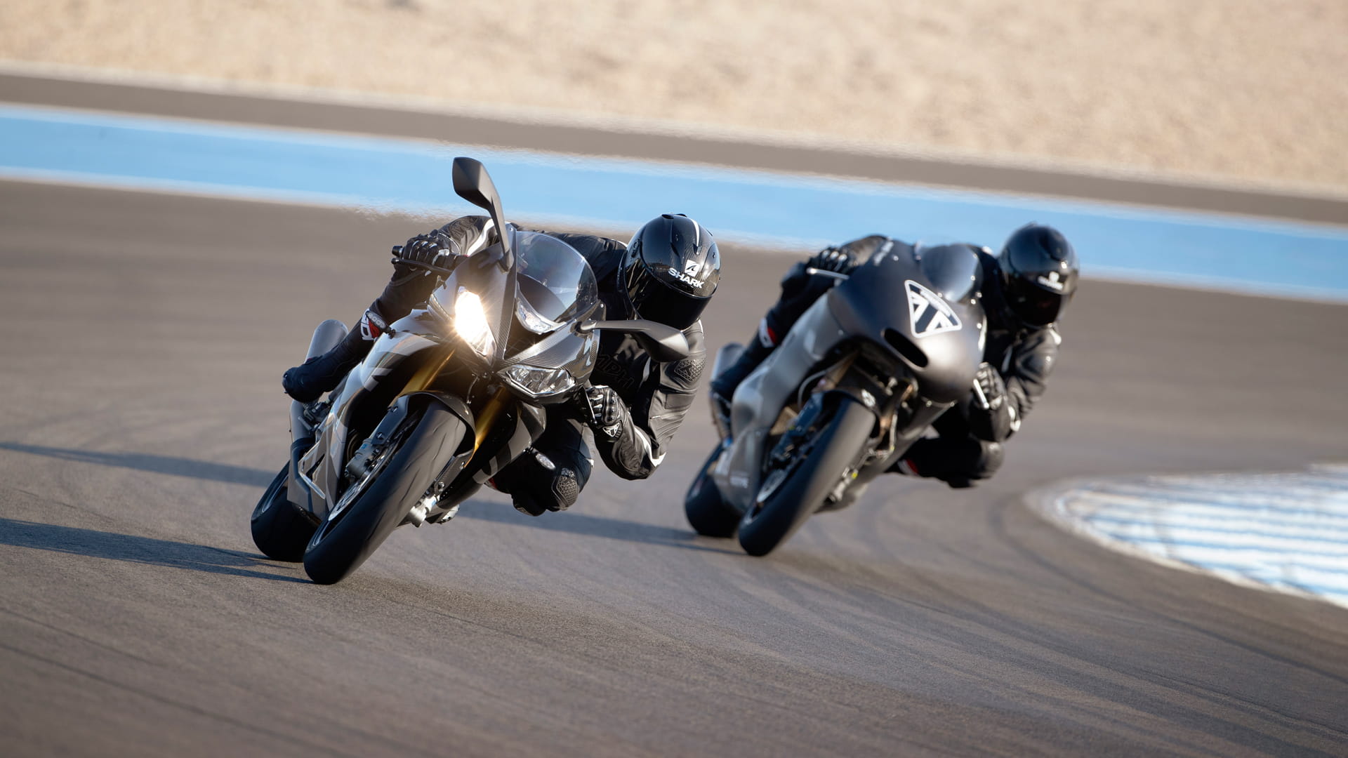 Triumph Daytona Moto2TM 765 motorcycle (EU and Asia Edition) racing around the track with Triumph's prototype Moto2TM motorcycle