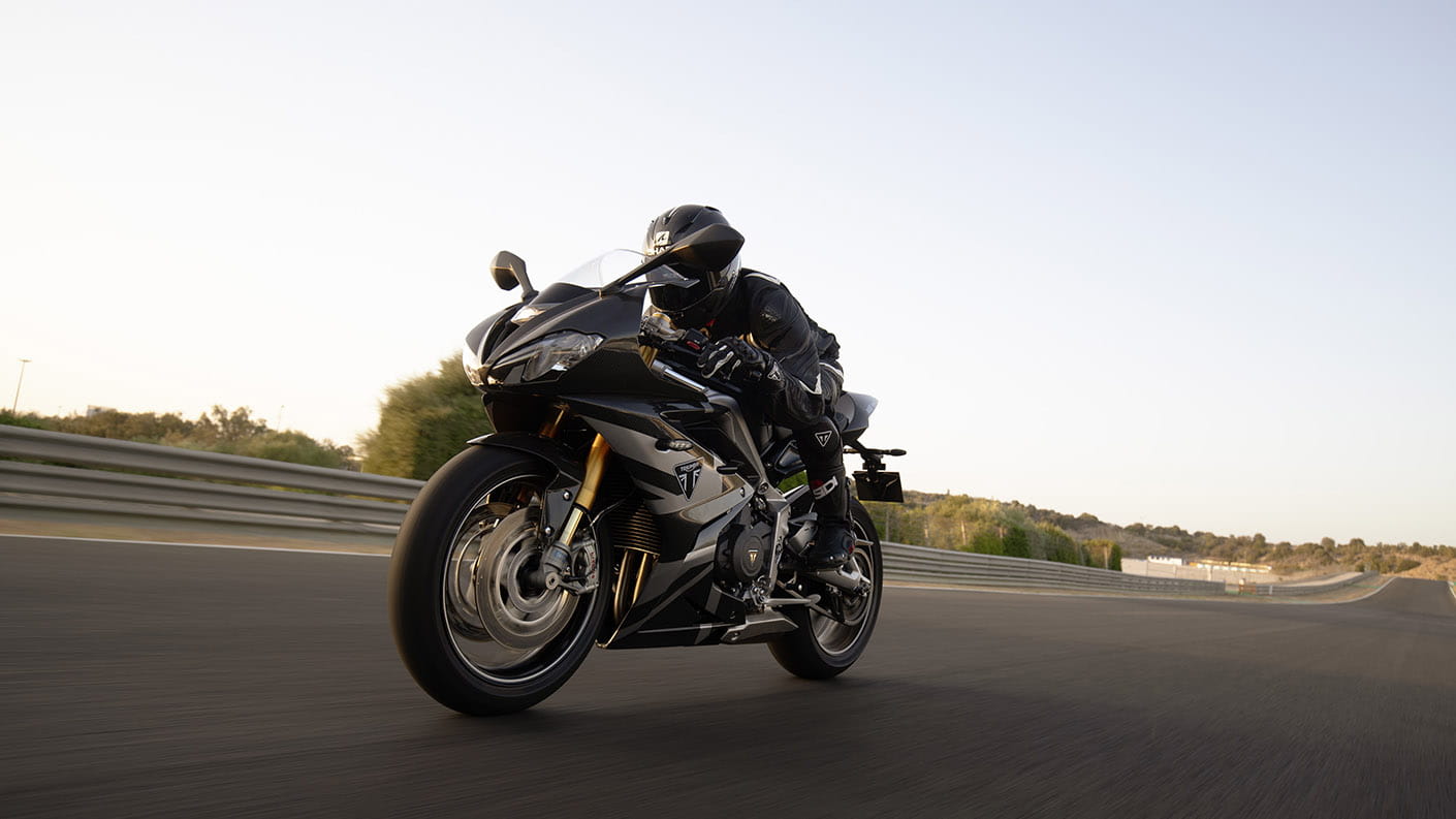 Triumph Daytona Moto2TM 765 motorcycle (EU and Asia Edition) racing around a race track at speed