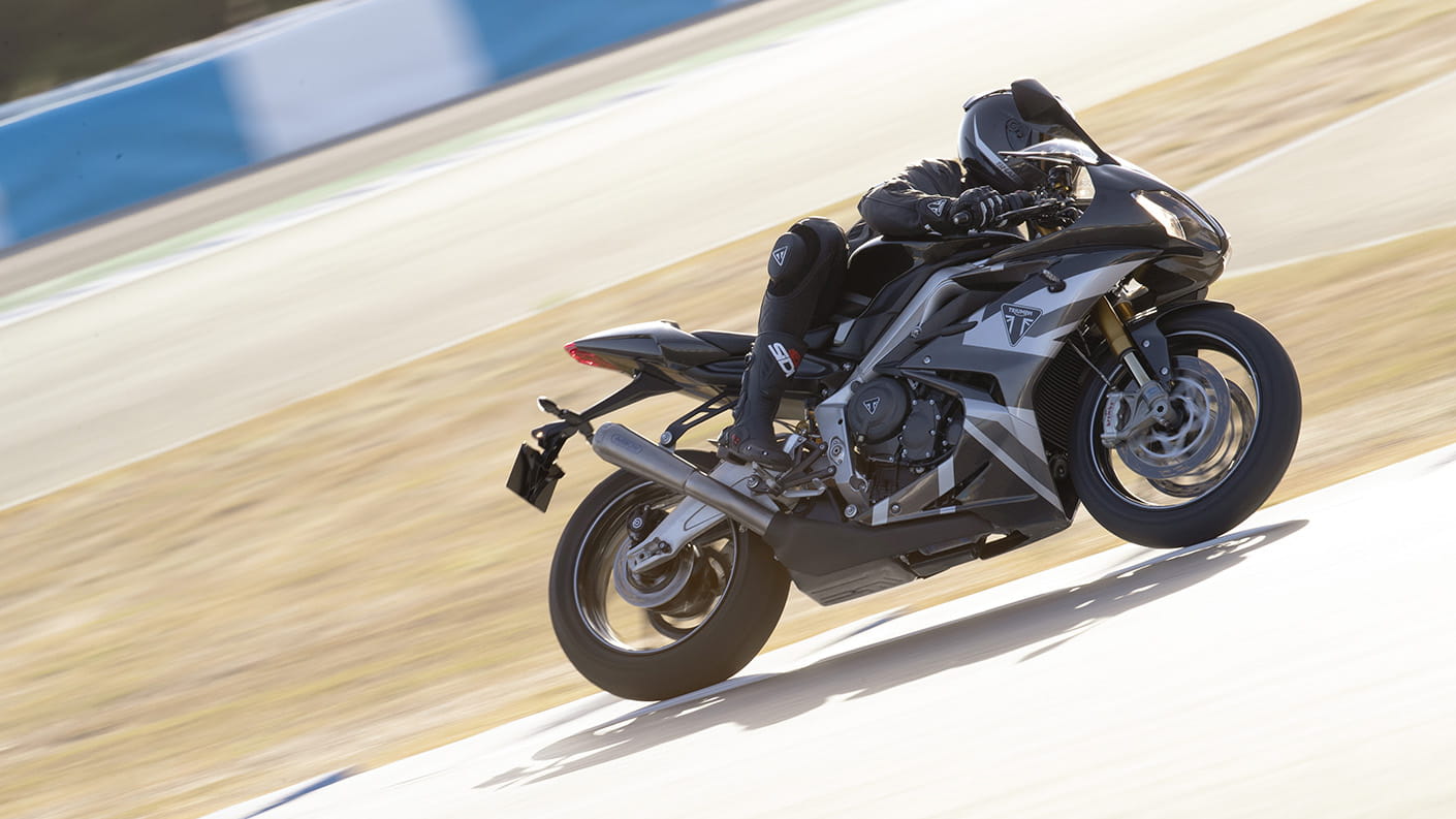 Triumph Daytona Moto2TM 765 motorcycle (EU and Asia Edition) racing around a race track at speed