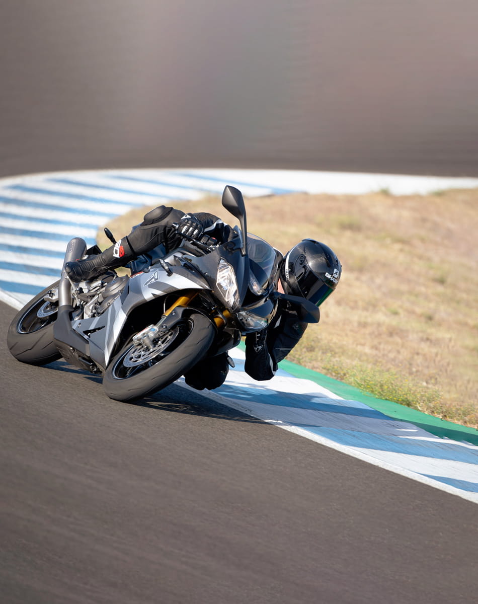 Triumph Daytona Moto2TM 765 motorcycle (EU and Asia Edition) racing around a track at speed