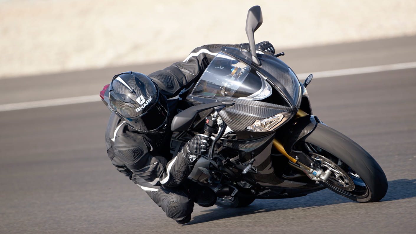 Triumph Daytona Moto2TM 765 motorcycle (EU and Asia Edition) racing around a track at speed