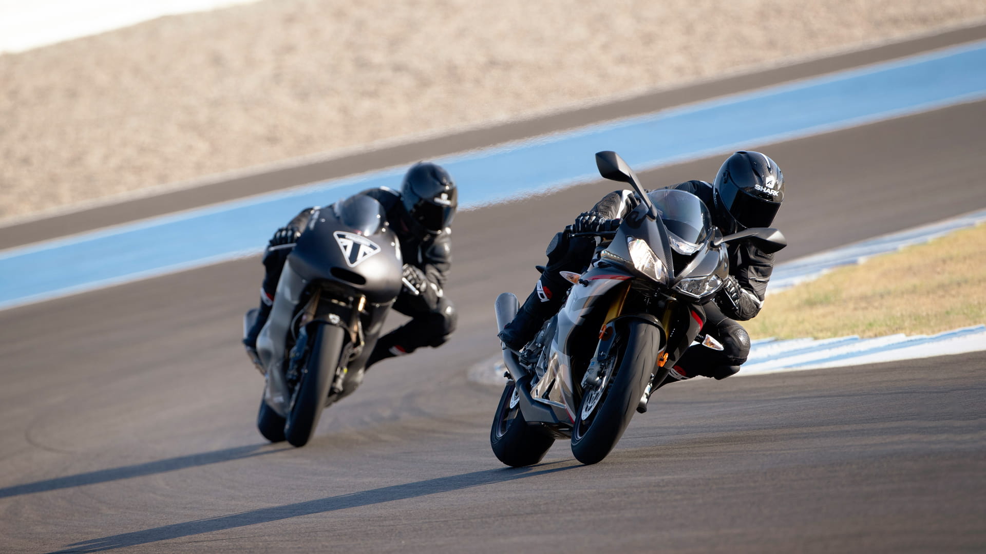 The USA Daytona Moto2™ 765 racing on the track with Triumph's Prototype Moto2™ motorcycle  